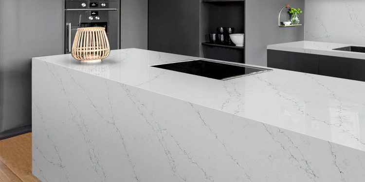 Modern kitchen island with white quartz worktop featuring subtle marble veining, showing the premium look achieved at an affordable price.